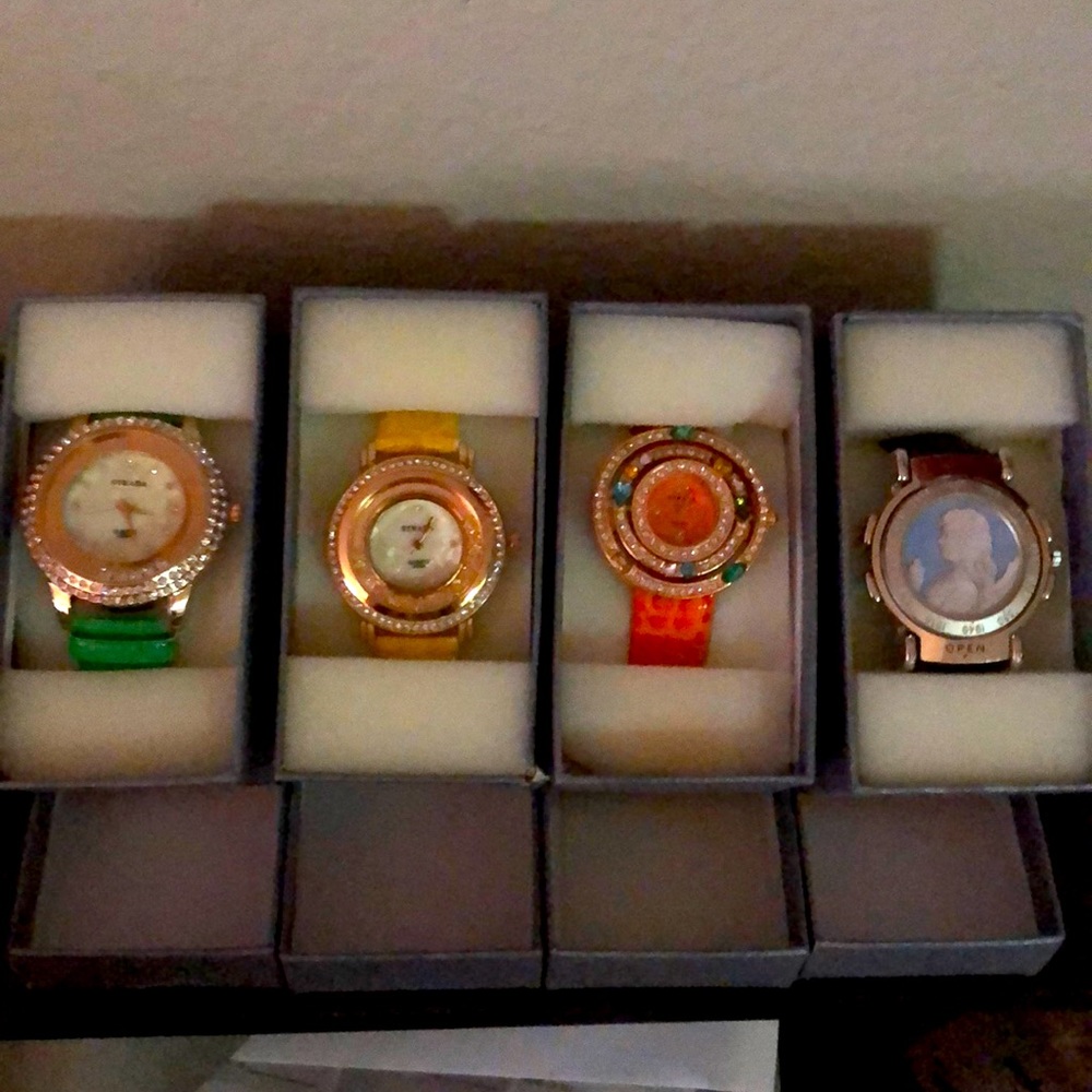 Four brand new working watches, $80.00 for all.
